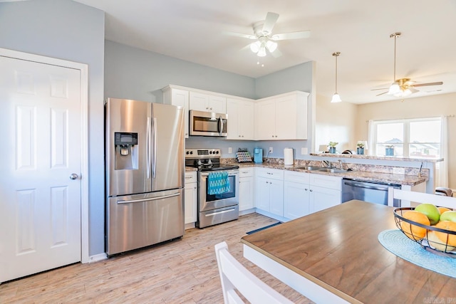 kitchen with white cabinets, sink, and stainless steel appliances