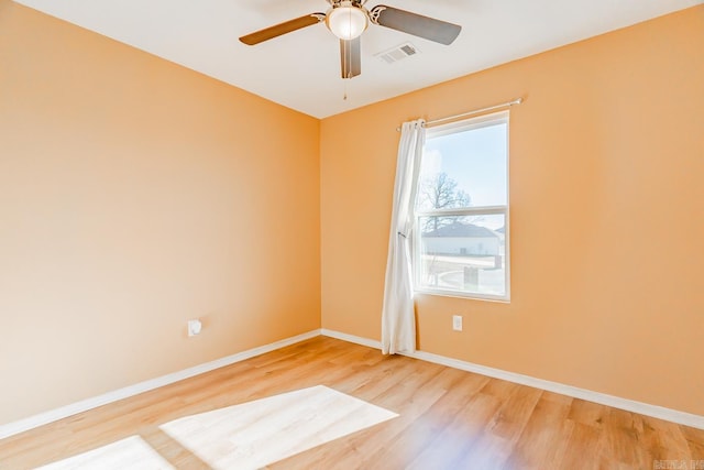 unfurnished room featuring ceiling fan, plenty of natural light, and light wood-type flooring