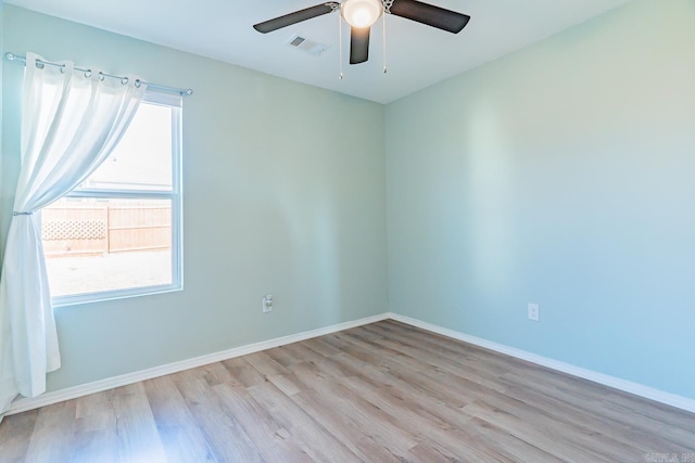 spare room featuring light hardwood / wood-style floors and ceiling fan