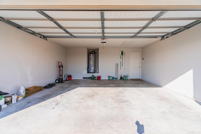 garage with a garage door opener and water heater