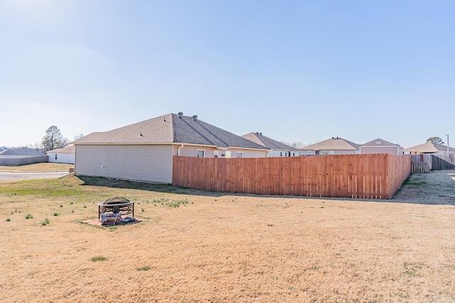 view of yard with an outdoor fire pit