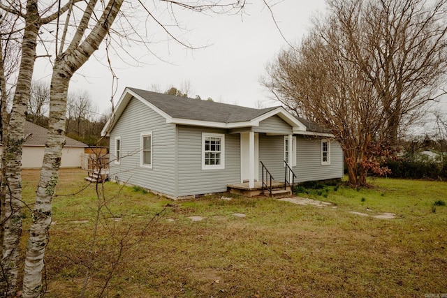 back of house featuring a yard