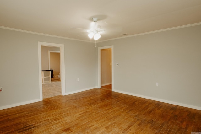 unfurnished room featuring crown molding, ceiling fan, and hardwood / wood-style flooring