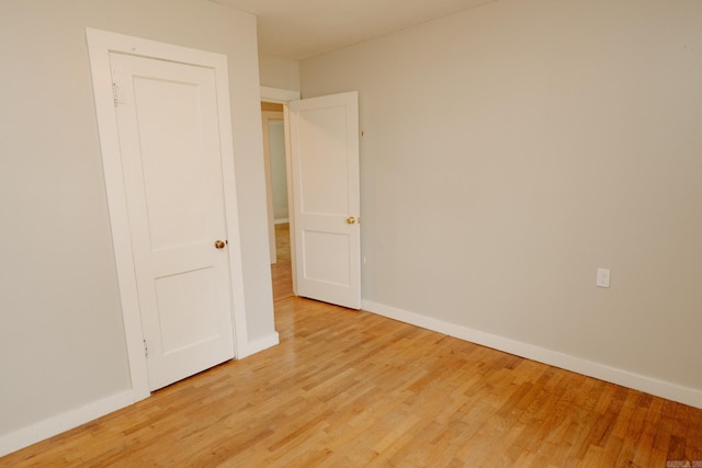 unfurnished bedroom featuring light wood-type flooring