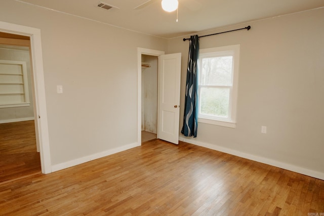 unfurnished bedroom with light hardwood / wood-style flooring and ceiling fan