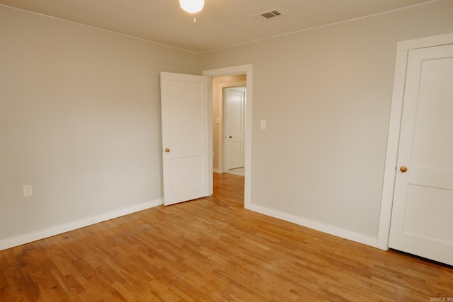 unfurnished room with light hardwood / wood-style flooring