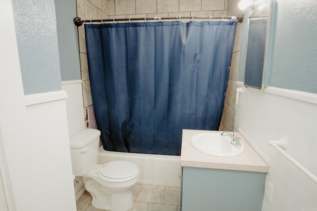 full bathroom with tile patterned floors, vanity, toilet, and shower / bathtub combination with curtain