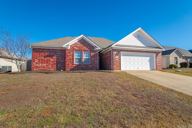 ranch-style home with a front lawn and a garage