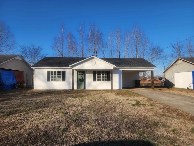 single story home with a carport and a front lawn