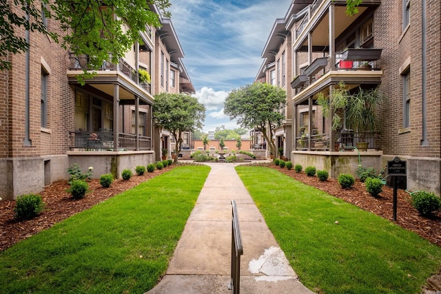 view of property's community with a lawn