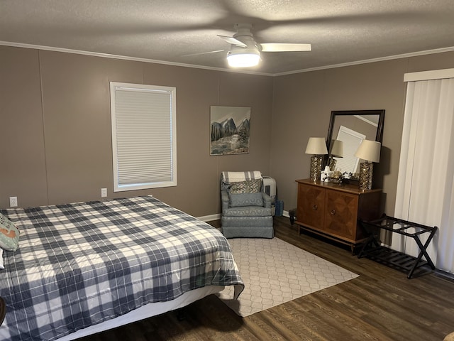 bedroom with dark wood-type flooring, ceiling fan, crown molding, and a textured ceiling