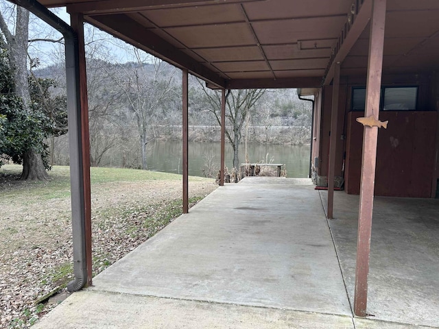 view of patio with a water view