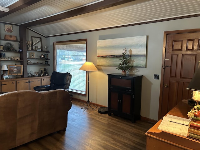 interior space with dark wood-type flooring, beam ceiling, and ornamental molding