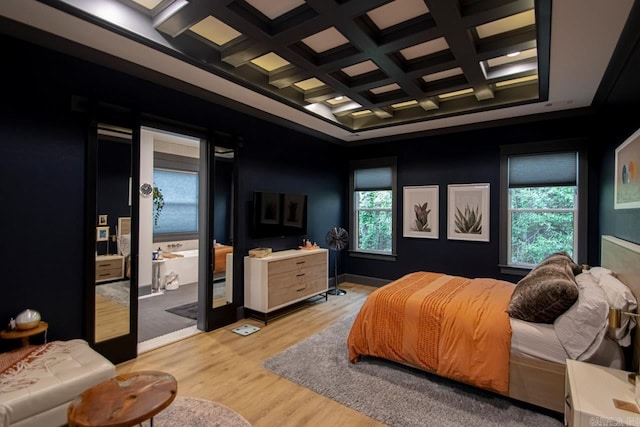 bedroom featuring beamed ceiling, light wood-type flooring, and coffered ceiling