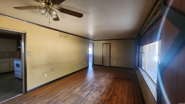 unfurnished bedroom featuring ceiling fan, dark hardwood / wood-style flooring, and ornamental molding