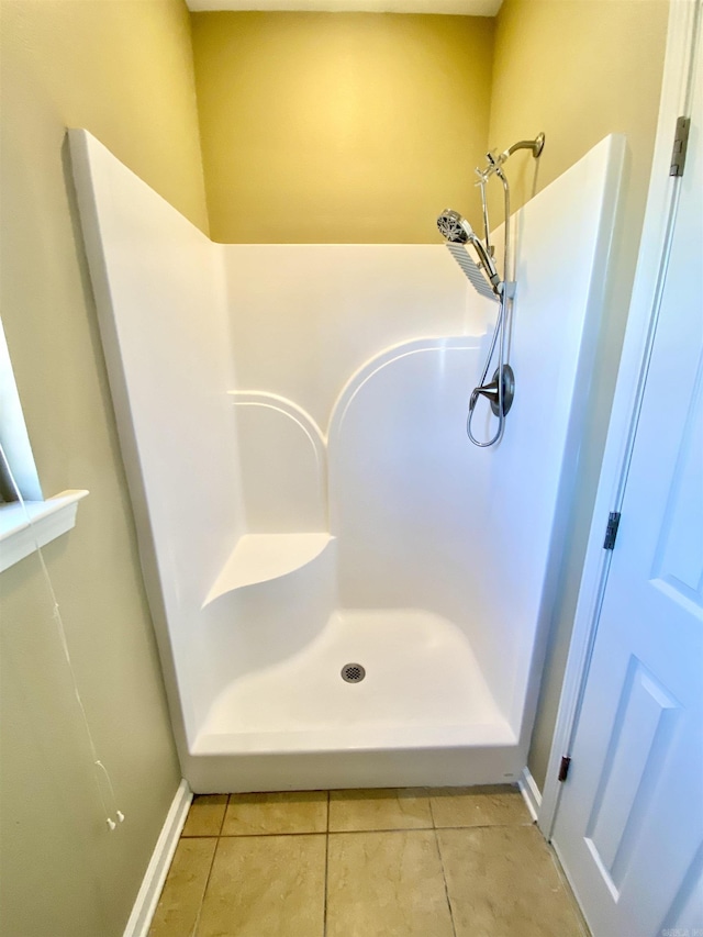 bathroom featuring tile patterned flooring and walk in shower