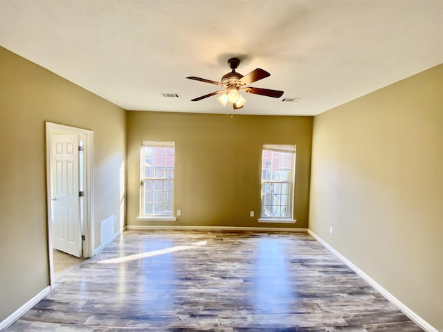 unfurnished room with ceiling fan and wood-type flooring