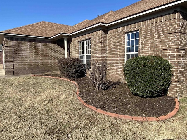 view of property exterior featuring a lawn