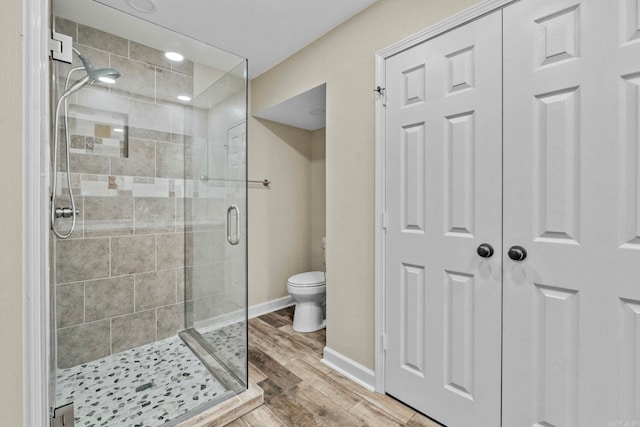 bathroom with toilet and walk in shower