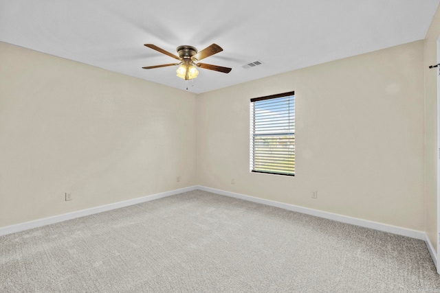 spare room featuring carpet flooring and ceiling fan