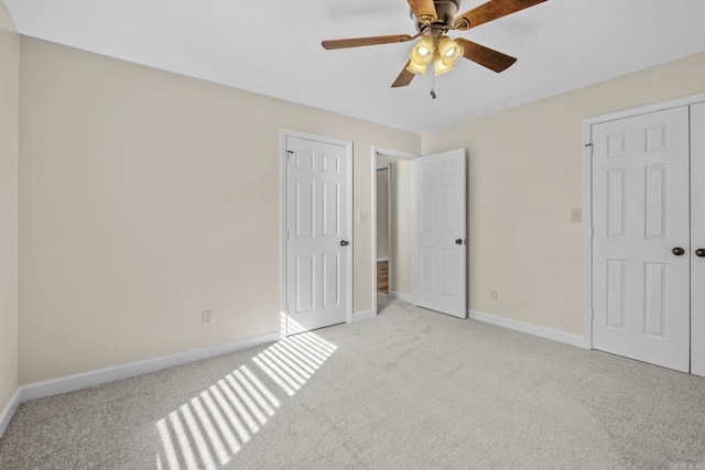 unfurnished bedroom with light carpet and ceiling fan