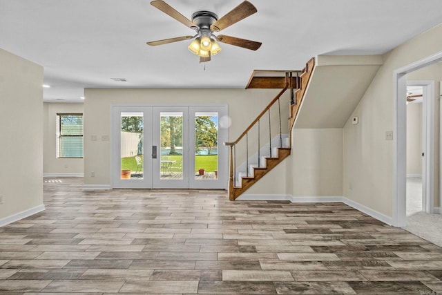 entrance foyer featuring ceiling fan, light hardwood / wood-style flooring, and french doors