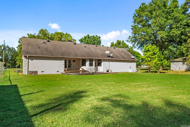 back of property featuring a patio area and a yard