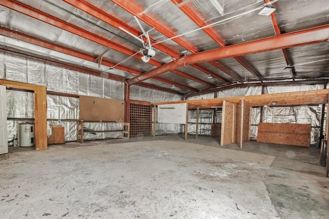 miscellaneous room featuring concrete floors and water heater