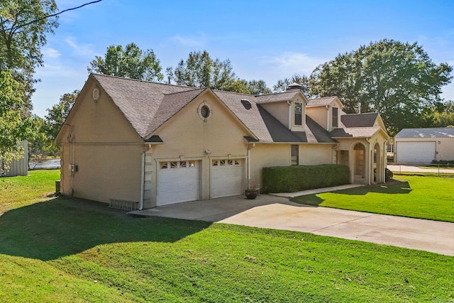 view of front of house featuring a front yard and a garage