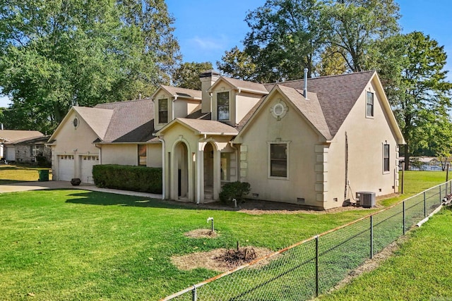 view of front of property with a garage, a front lawn, and central air condition unit