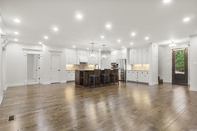 living room with dark hardwood / wood-style flooring and sink