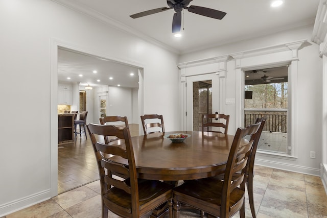 dining room with ceiling fan and crown molding