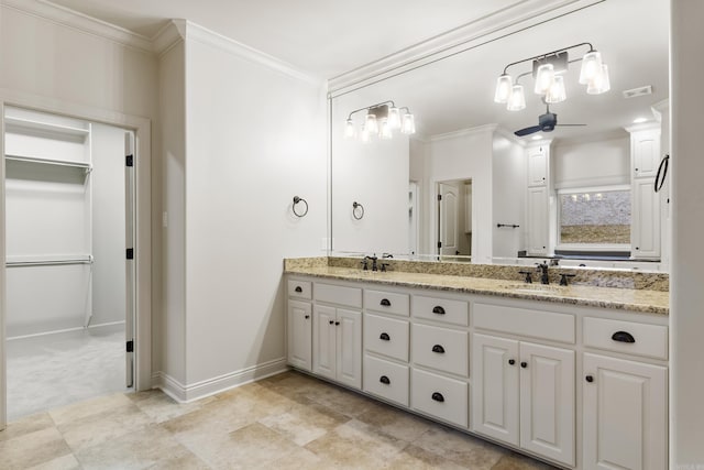 bathroom with vanity and ornamental molding