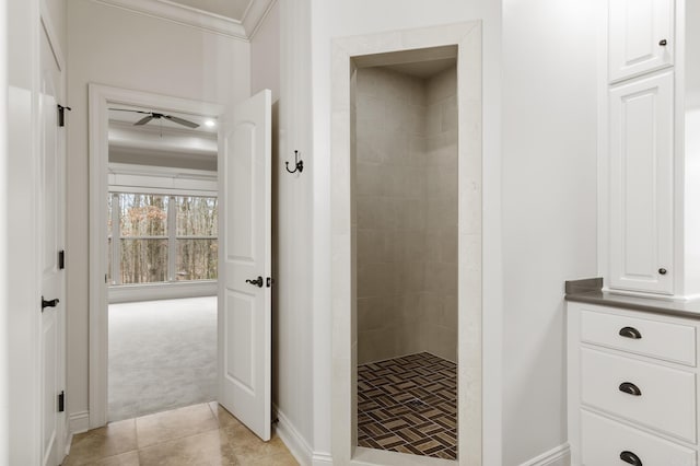 bathroom with a shower, crown molding, tile patterned floors, and ceiling fan