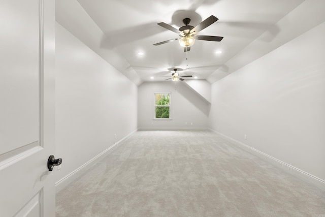 bonus room featuring light colored carpet, vaulted ceiling, and ceiling fan