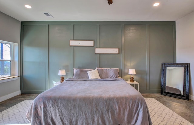 bedroom with concrete flooring and ceiling fan