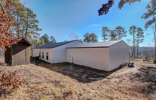 view of side of property with an outdoor structure