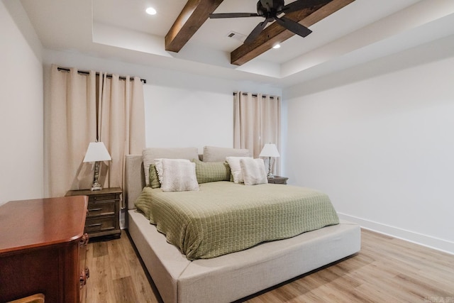 bedroom featuring beamed ceiling, ceiling fan, and wood-type flooring