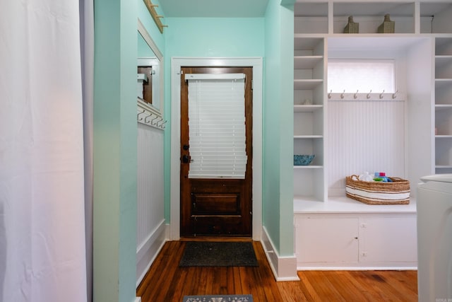 entryway with hardwood / wood-style floors and washer / dryer