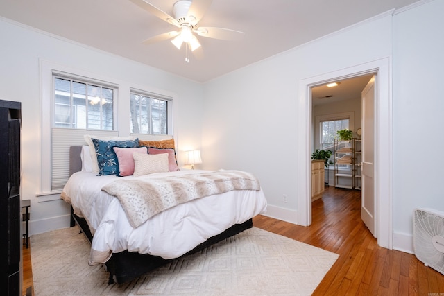 bedroom featuring ceiling fan and hardwood / wood-style flooring