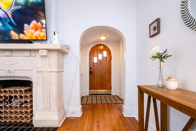 entryway with hardwood / wood-style floors