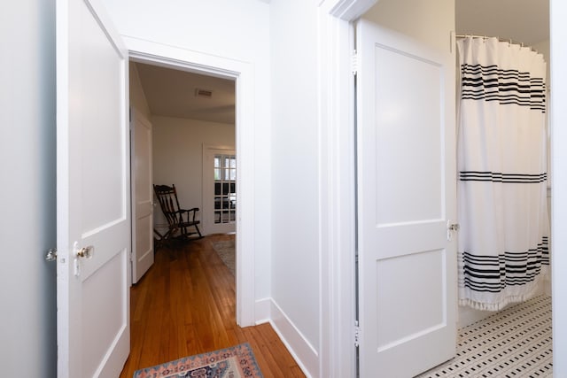 hallway featuring hardwood / wood-style floors