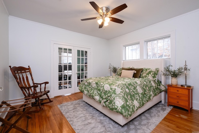 bedroom with ceiling fan, crown molding, and hardwood / wood-style flooring