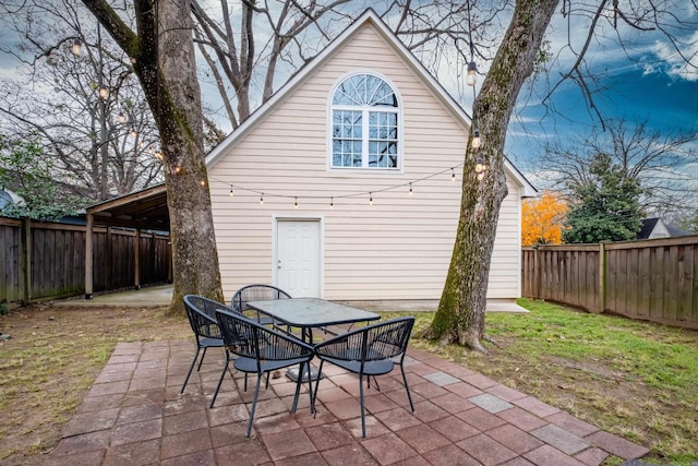 rear view of house with a patio