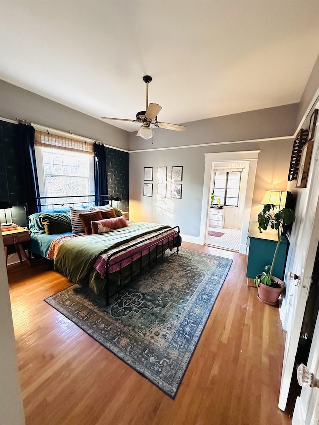 bedroom featuring wood-type flooring and ceiling fan