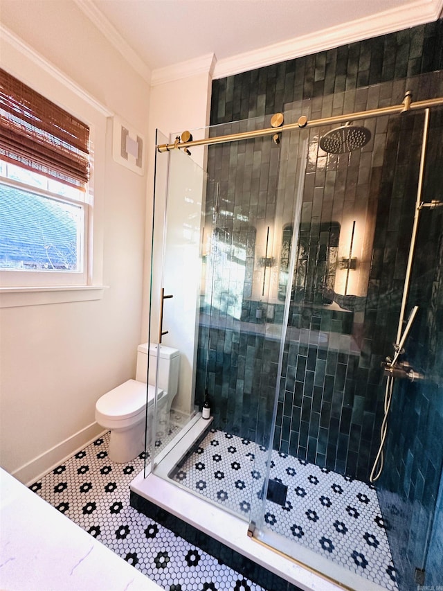 bathroom featuring toilet, tile patterned flooring, a shower with shower door, and ornamental molding