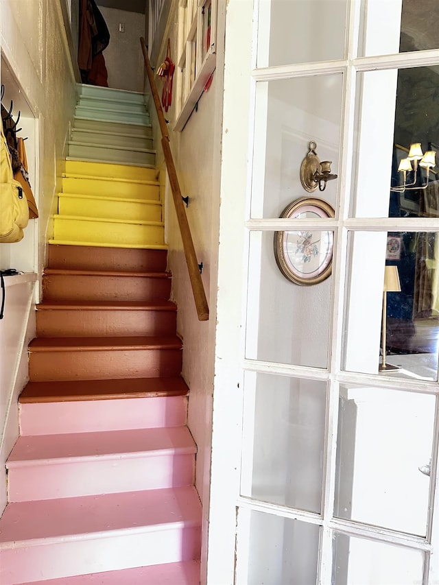 staircase with a fireplace