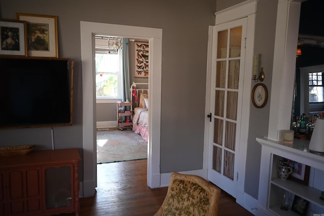 hallway featuring dark hardwood / wood-style flooring