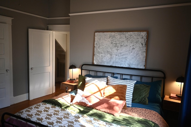 bedroom with wood-type flooring