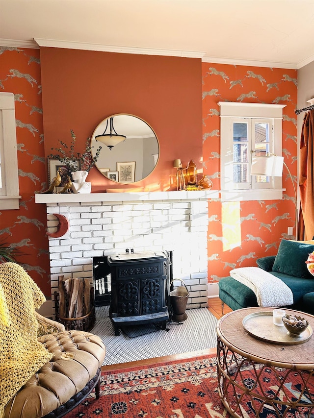 living room featuring a wood stove and crown molding